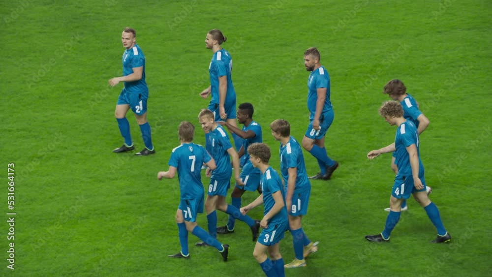 Soccer Football Championship: Blue Team Attack and Score Goal, Win the Match, Players Happy, Celebrate Victory, Winners Leave Field. Sport Channel Broadcast Television Playback in Slow Motion Soccer Football Championship: Blue Team Attack and Score Goal, Win the Match, Players Happy, Celebrate Victory, Winners Leave Field. Sport Channel Broadcast Television Playback in Slow Motion