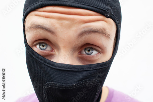 Portrait of a young man in a black balaclava