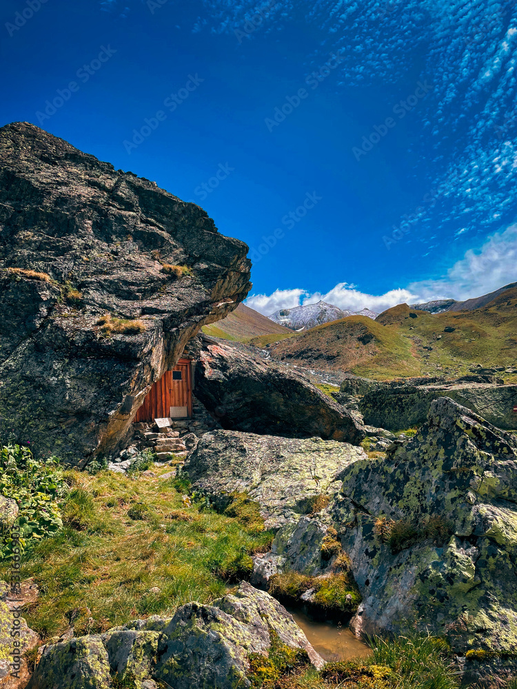 Door in rock in valley near Jamtalhütte in Austria Door in rock in valley near Jamtalhütte in Austria