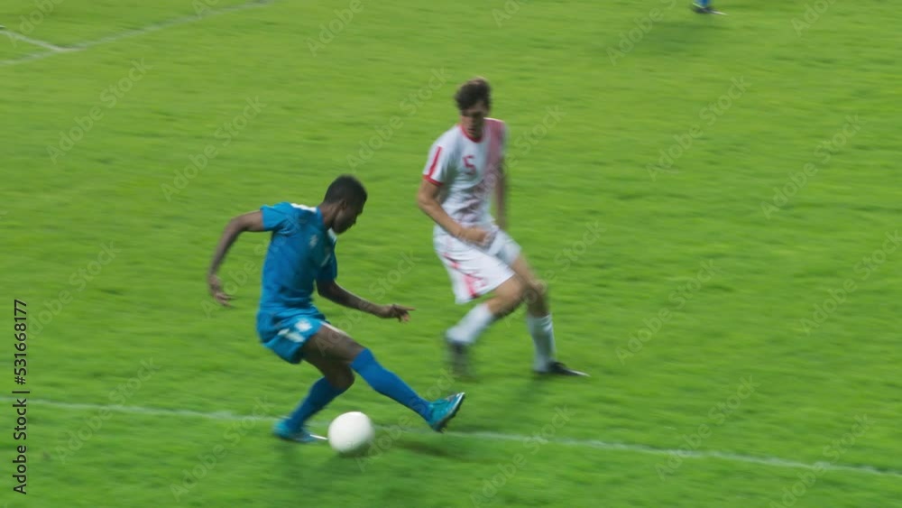 Soccer Football Match Event on a Major League Championship: White Team Attacks, Playing Pass, Dribbling. Dynamic Action Game on Tournament. Live Sport Channel Broadcast Television Playback Soccer Football Match Event on a Major League Championship: White Team Attacks, Playing Pass, Dribbling. Dynamic Action Game on Tournament. Live Sport Channel Broadcast Television Playback