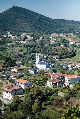 View of the village houses and a church in the hills of the Douro Valley, Porto, Portugal.