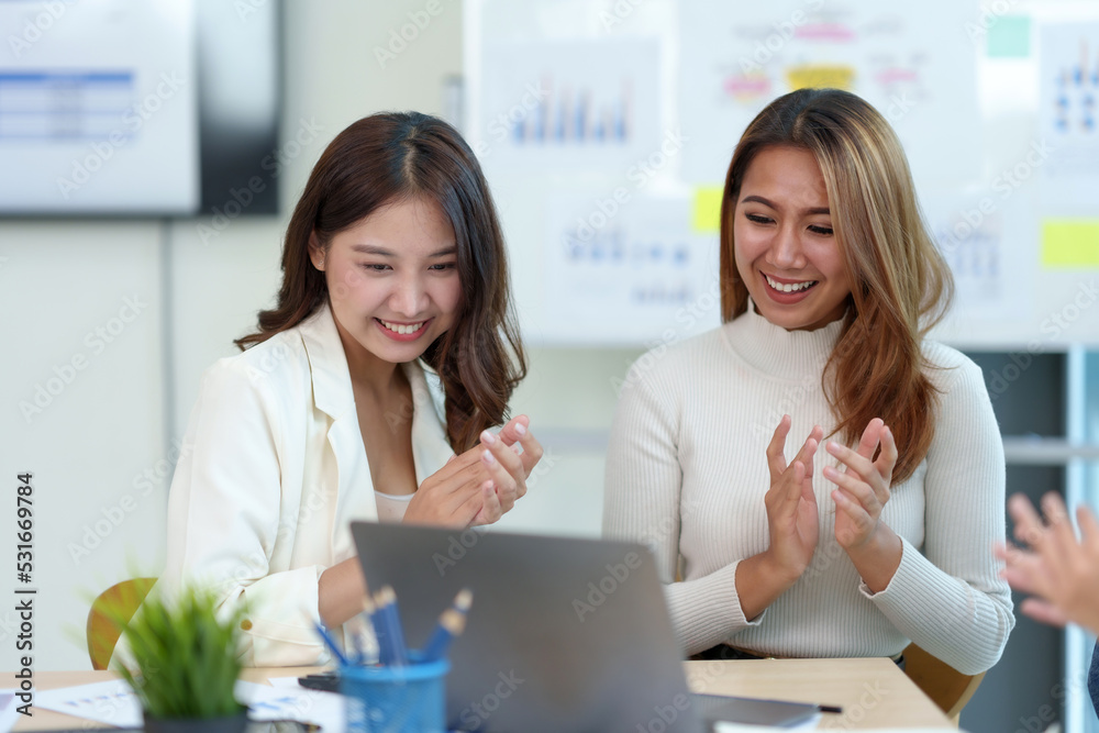 Group of Asian businessman working as a team applauded the results at the meeting, delighted that the event was accomplished beautifully and successfully. Group of Asian businessman working as a team applauded the results at the meeting, delighted that the event was accomplished beautifully and successfully.