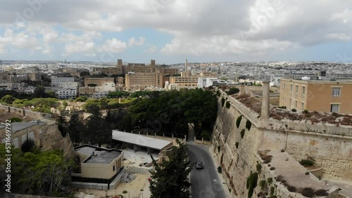 Aerial view of mediterranean city and fortifications with St. Lukes hospital in  background. from Argotti Botanic Garden, Floriana, Malta photo