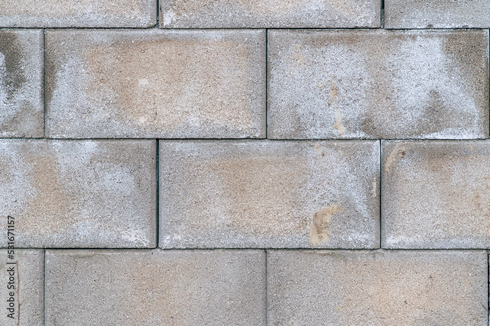 a grey concrete brick wall background texture a grey concrete brick wall background texture