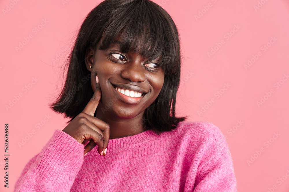 Portrait of young beautiful happy smiling african woman touching cheek Portrait of young beautiful happy smiling african woman touching cheek