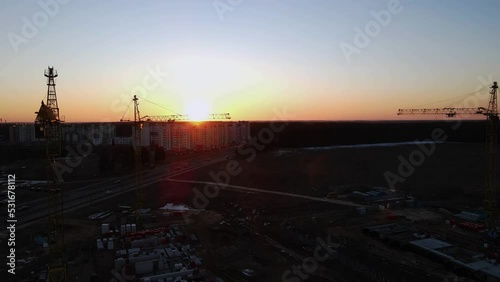 Wallpaper Mural construction site at sunset, construction cranes on the background of sunset, Torontodigital.ca