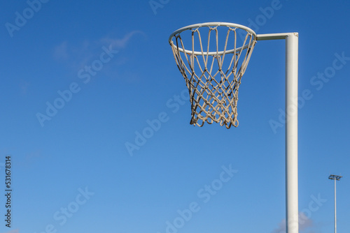 netball hoop against blue sky photo