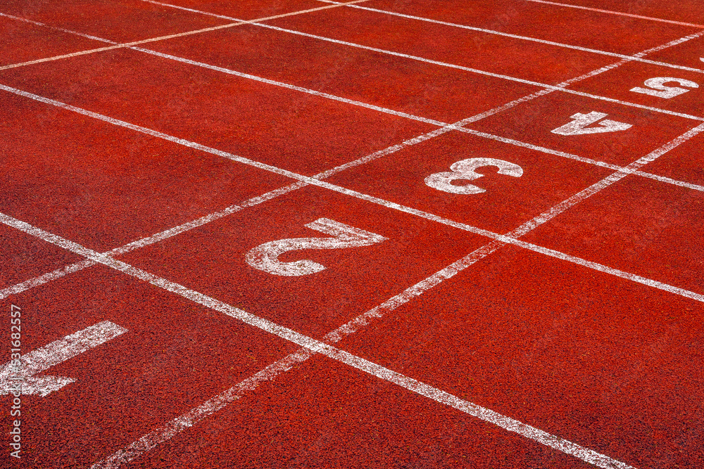 Start points with numbers on running track or athlete track in stadium
