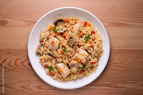 Rice paella with turkey and vegetables. Healthy recipe.
