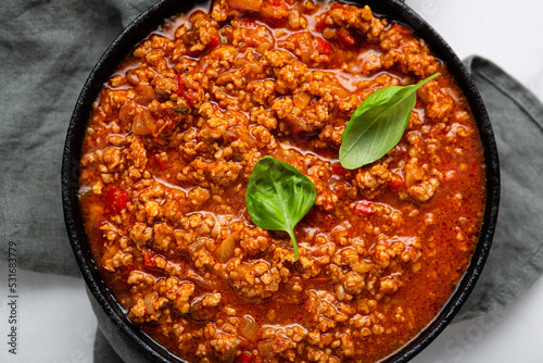 Traditional italian bolognese sauce in saucepan for pasta top view cooking food