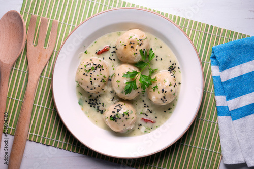 Fish meatballs with white wine sauce. Traditional tapas from Barcelona, ​​Spain.