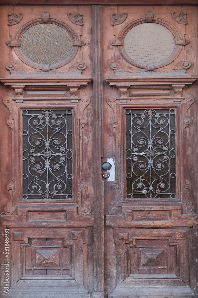 Old entrance wooden doors of an old house or building. Old entrance wooden doors of an old house or building.