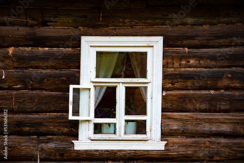 the window of an old log house
