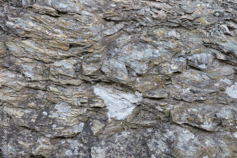 Close-up on the stone texture of mountain rock. Background. Close-up on the stone texture of mountain rock. Background.