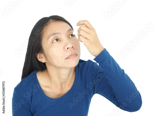 Woman drips eye drops into her eyes. Eye disease concept. Closeup photo, blurred. photo