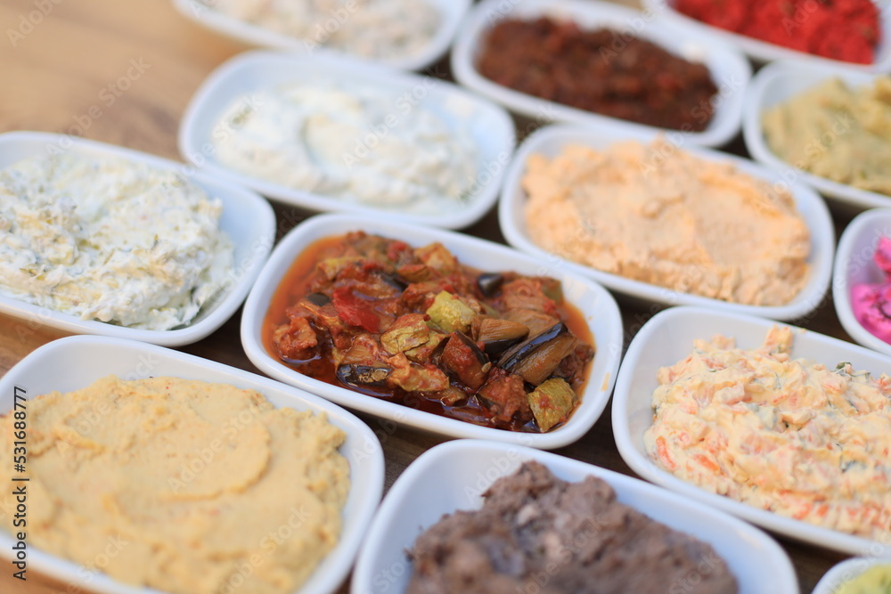 Meze or mezze is a selection of small dishes served as appetizers in much of West Asia, Middle East, and the Balkans. Meze is often served as a part of multi-course meals.