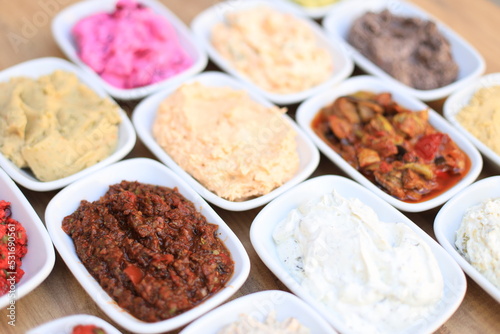  ​Meze or mezze is a selection of small dishes served as appetizers in much of West Asia, Middle East, and the Balkans. Meze is often served as a part of multi-course meals. © cagdas