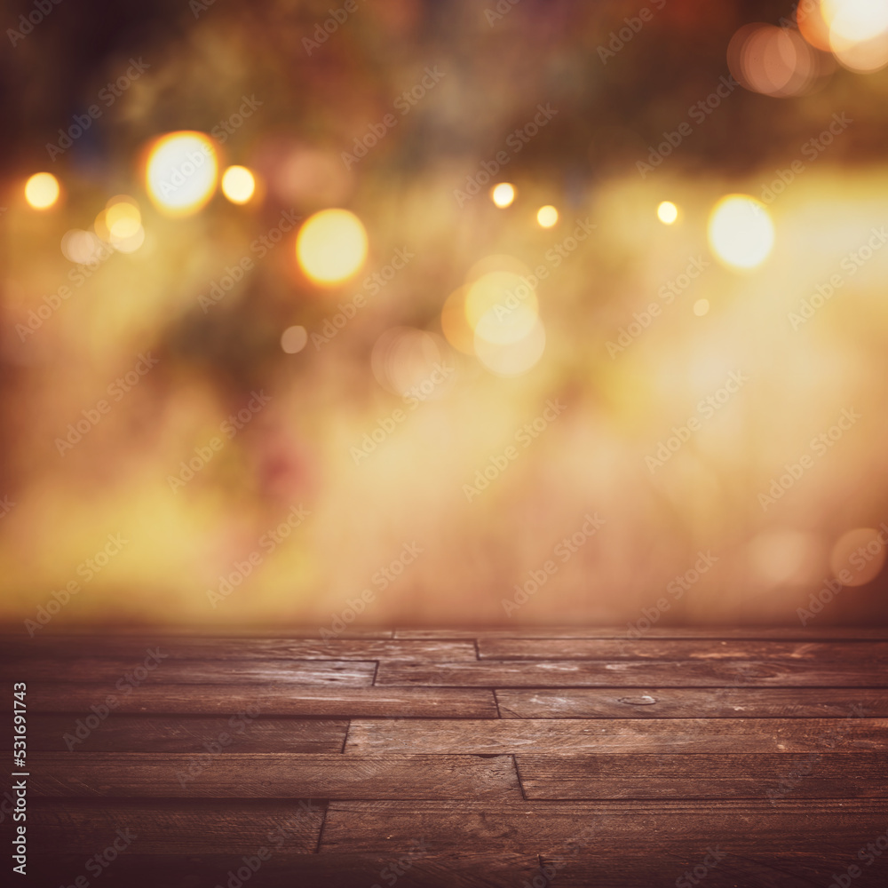 Golden autumn background with bokeh and empty wooden table for thanksgiving and christmas decorations and sesonal messages. Golden autumn background with bokeh and empty wooden table for thanksgiving and christmas decorations and sesonal messages.