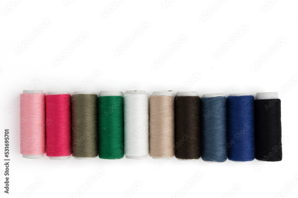 sewing colored threads isolated on white sewing colored threads isolated on white