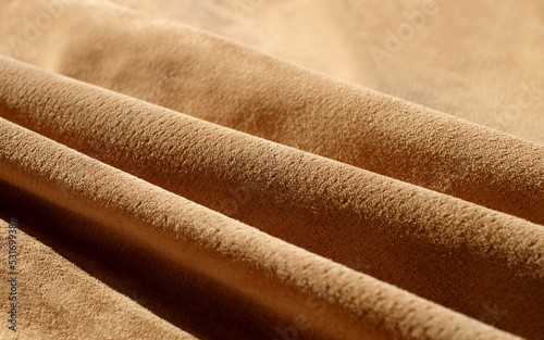 Suede leather waves diagonal close-up, texture of sand leather