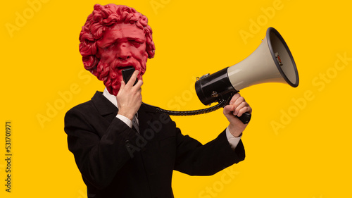 Abstract modern collage. The man with the plaster head of David with a megaphone on yellow background photo