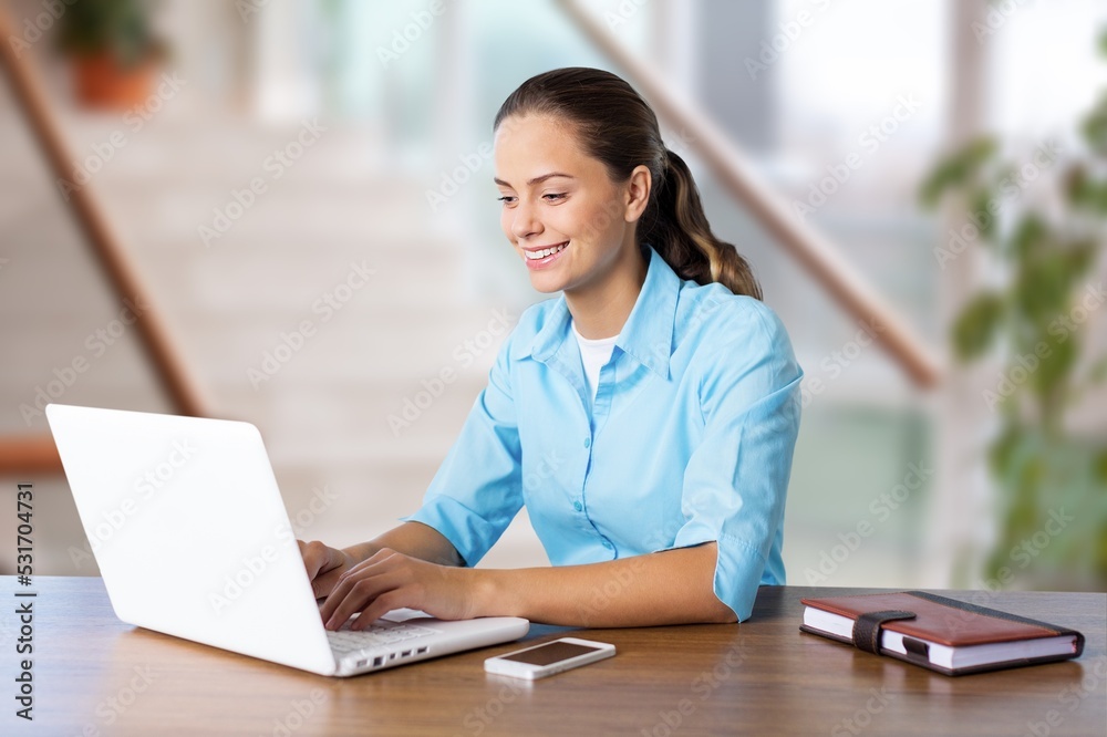 Woman student using computer laptop. Woman student using computer laptop.