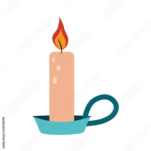 Burning candle in a flat candlestick with handle