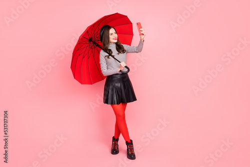 Fotografie, Obraz Charming stylish lady influencer travel parasol make self portrait device wear p