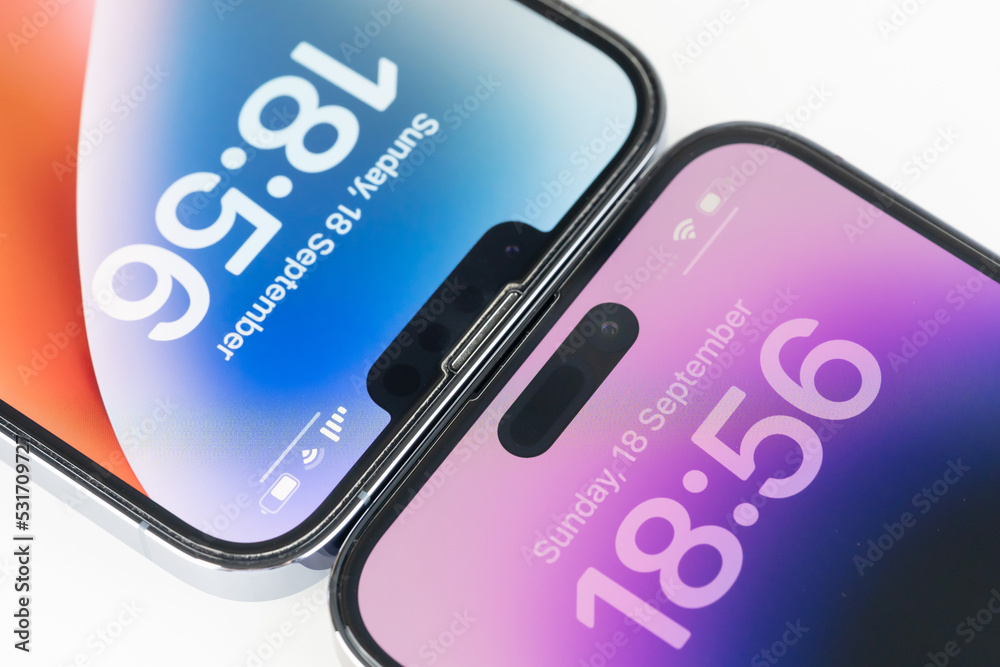 Close up compare the big change of dynamic island on iPhone 14 Pro Max Deep  Purple and Notch on iPhone 13 Pro Max Seirra Blue on white background  Photos | Adobe Stock