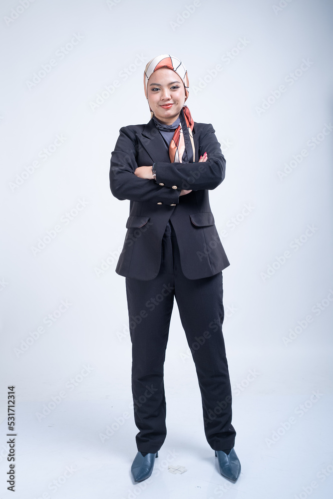 Portrait of a beautiful female Muslim model wearing hijab, a lifestyle apparel for Muslim women isolated from background. Modern hijab fashion concept. Portrait of a beautiful female Muslim model wearing hijab, a lifestyle apparel for Muslim women isolated from background. Modern hijab fashion concept.