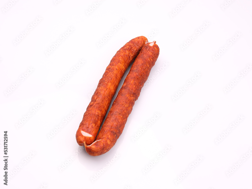 Traditional smoked pork sausage, long, isolated. Polish meat sausage, a packshot photo for package design. Traditional smoked pork sausage, long, isolated. Polish meat sausage, a packshot photo for package design.