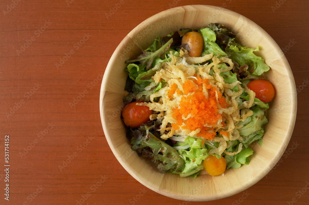 Shirauo (Japanese icefish) Salad with orange fish roe on top in wooden dish. Copy space wallpaper. Shirauo (Japanese icefish) Salad with orange fish roe on top in wooden dish. Copy space wallpaper.