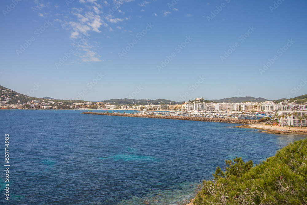 Beautiful seascape of the Mediterranean Sea and rocky coast of Ibiza island with bay of Santa Eulalia del Rio, Spain