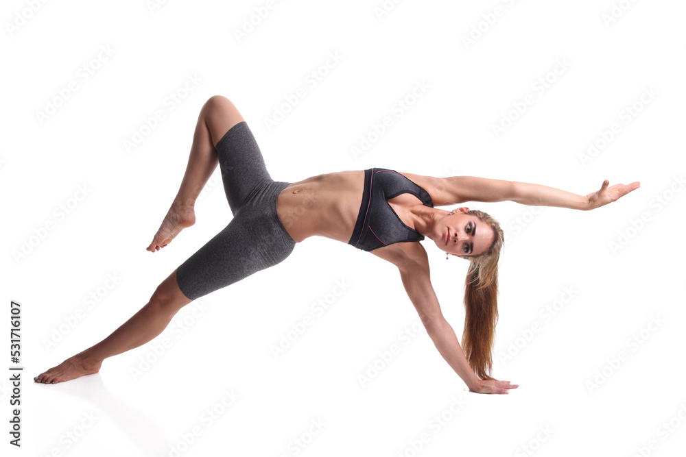 Beautiful young woman doing yoga exercise