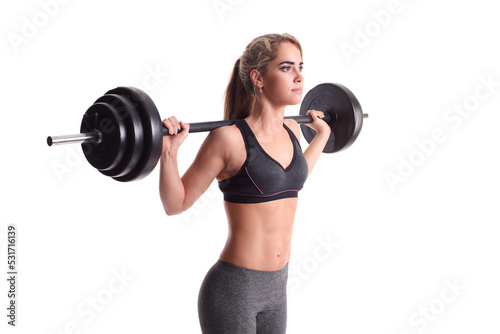 smiling sporty woman exercising with barbell