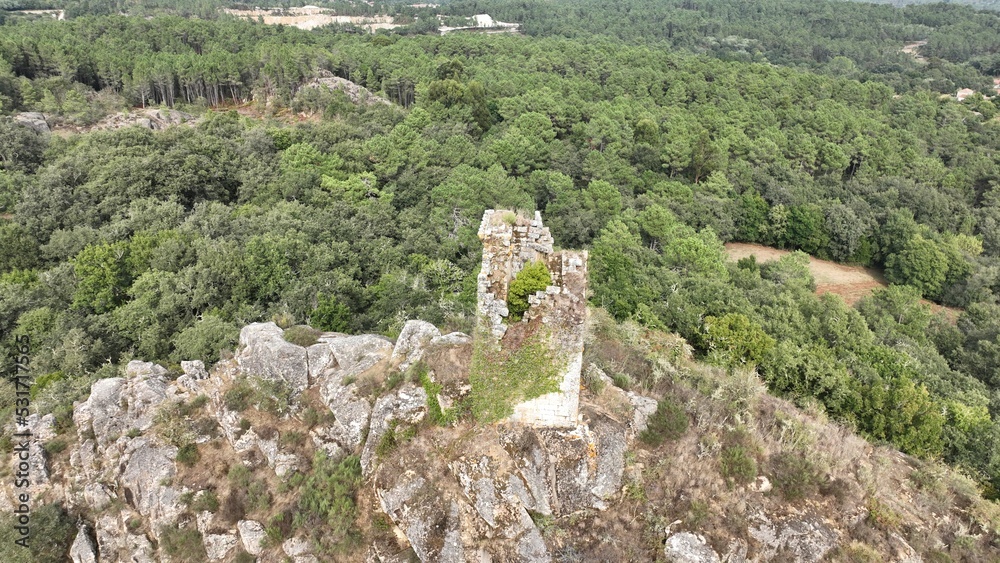 Aerial shot of  a medieval tower  on a cliff , located at Sande, Cartelle, Ourense, Spain