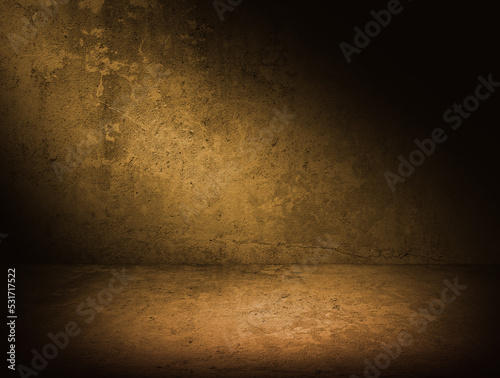 Empty concrete room with warm tone lightning. Dark concrete background with spotlight for mock up or product display. Urban photography studio backdrop.