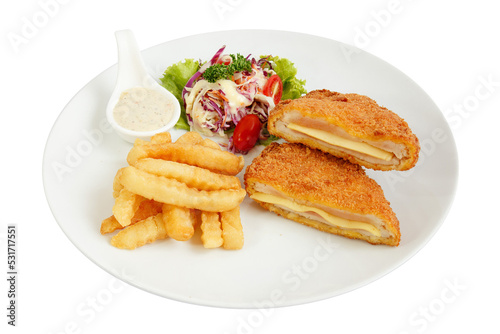Pork cutlet served with french fries and tartar sauce.