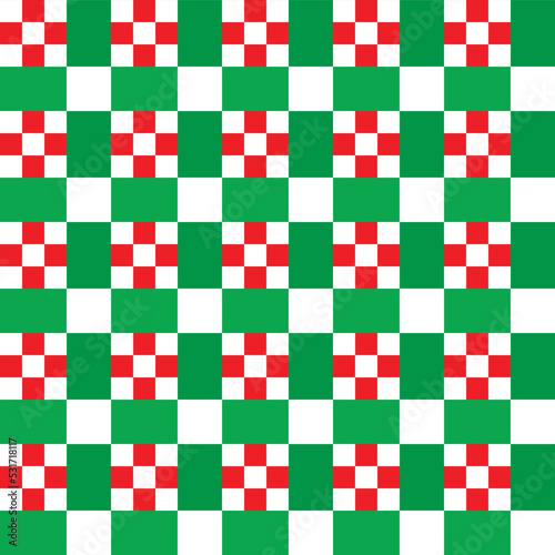 White square dots on red and green checker pattern background. Christmas background.