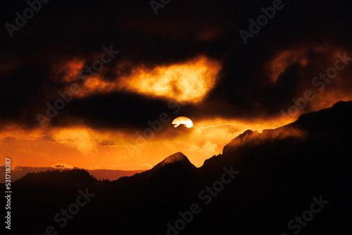 dramatic firy sunset in the fribourg alps