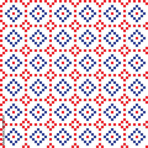 Red and blue cross-stitch knitting pattern on white background. Red and blue square dots on white backdrop. Fabric pattern design for sale. Knitting handicraft art.