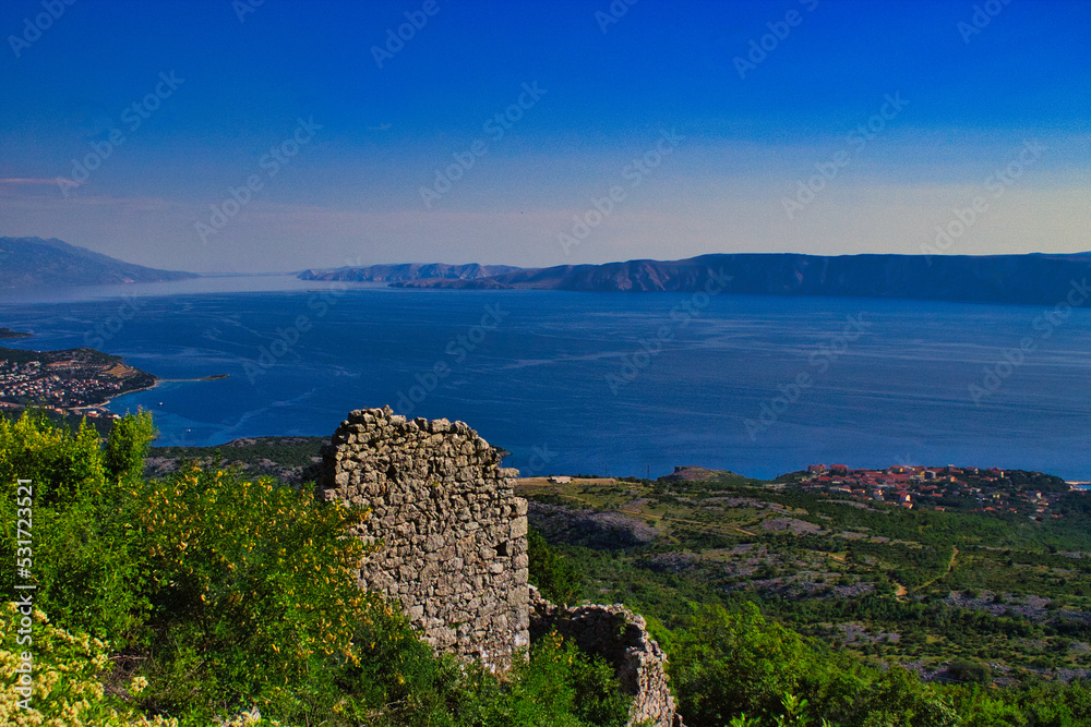 ruins of an old village in Croatia on a mountain with sea in background