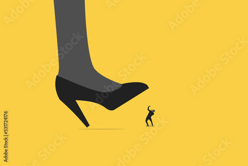 woman big shoes trying to stomping step on his small worker or businessman.