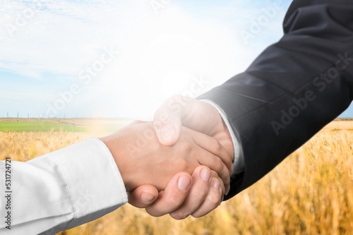 Handshake farmer in field. agricultural business concept