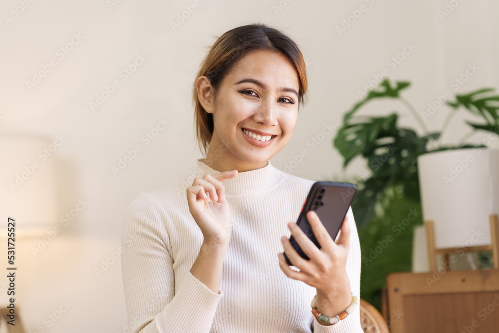 Attractive asian young woman using smartphone working office desk in office workplace. Attractive asian young woman using smartphone working office desk in office workplace.