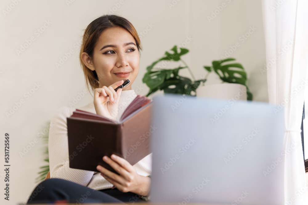 Attractive Asian business accounting working in office workplace, online planning successful business growth process. Attractive Asian business accounting working in office workplace, online planning successful business growth process.