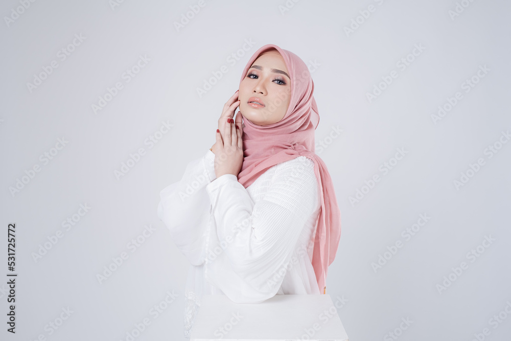 Portrait of a beautiful female Muslim model wearing hijab, a lifestyle apparel for Muslim women isolated. Modern hijab fashion concept. Portrait of a beautiful female Muslim model wearing hijab, a lifestyle apparel for Muslim women isolated. Modern hijab fashion concept.
