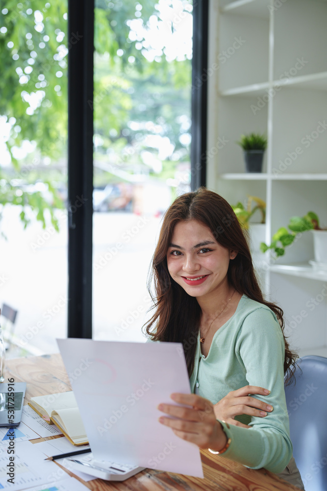 f girl, showing smiling faces while working on financial documents