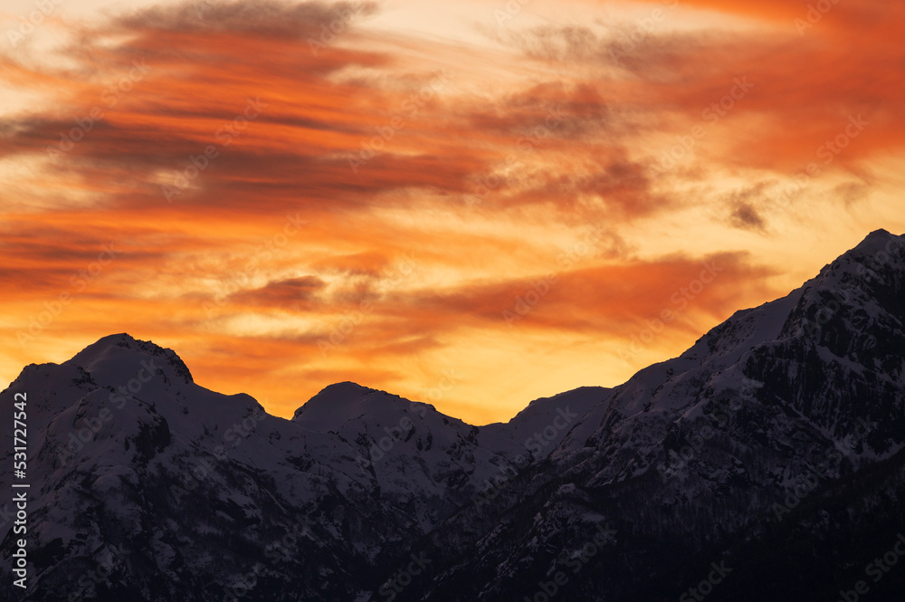 Fototapeta premium Sunset on the peaks of the Andes Mountains, Views from the San Carlos de Bariloche Circuit, Nahuel Huapi National Park. Patagonia, Argentina.