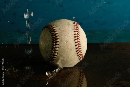Baseball rain game concept with ball in water.